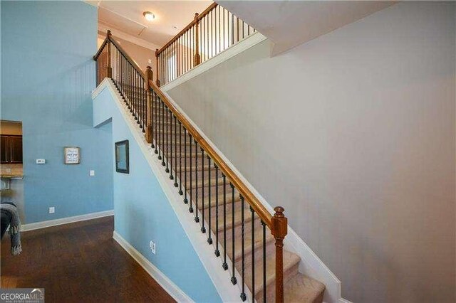 1480 Waverly Glen Dr, Alpharetta, GA 30004 - stairway with a towering ceiling and wood finished floors