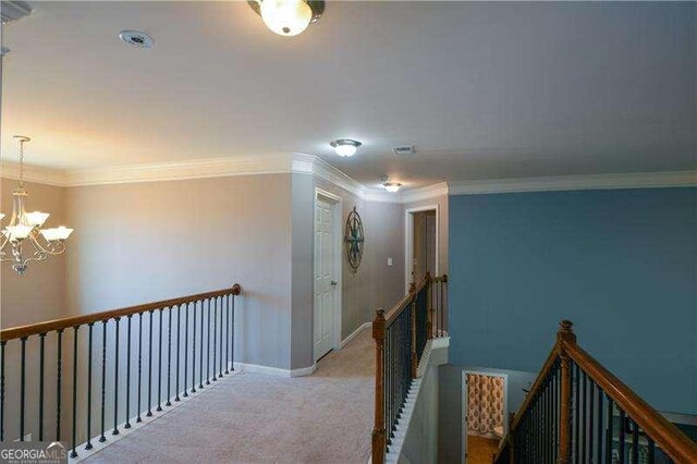 1480 Waverly Glen Dr, Alpharetta, GA 30004 - hallway with an upstairs landing, a chandelier, light colored carpet, and crown molding