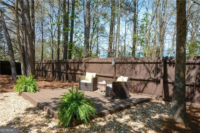 1480 Waverly Glen Dr, Alpharetta, GA 30004 - fenced backyard featuring a wooden deck