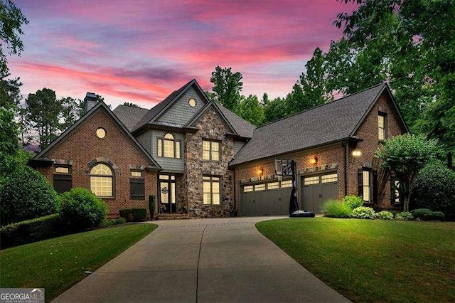 511 Etris Ct, Roswell, GA 30075 - view of front facade with driveway, an attached garage, a yard, and a chimney