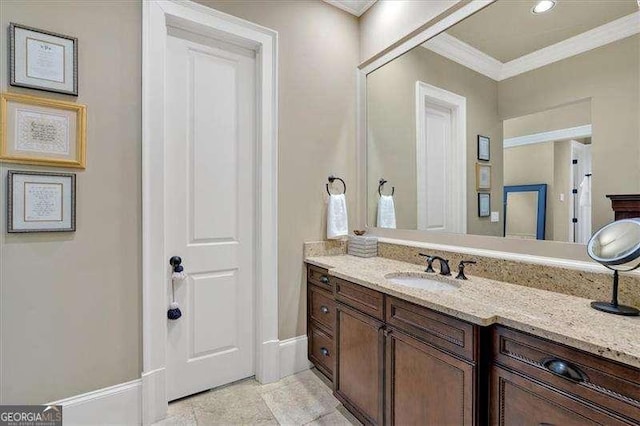 511 Etris Ct, Roswell, GA 30075 - bathroom featuring ornamental molding, vanity, and baseboards