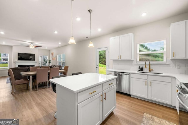 228 Whitneys Way, Dallas, GA 30157 - kitchen with appliances with stainless steel finishes, a ceiling fan, recessed lighting, plenty of natural light, and light countertops