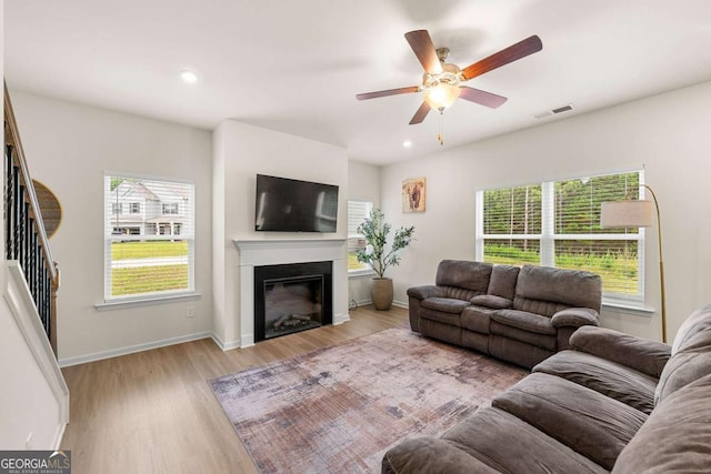 228 Whitneys Way, Dallas, GA 30157 - living area with wood finished floors, a ceiling fan, a glass covered fireplace, and recessed lighting