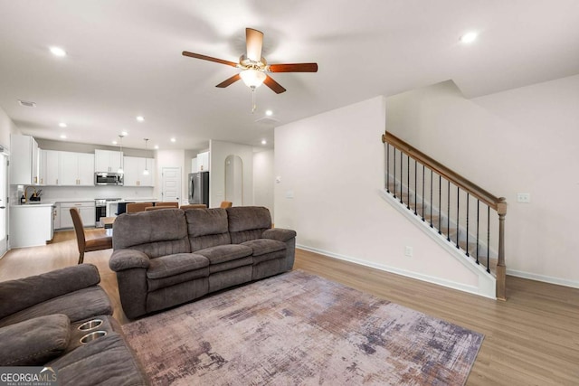 228 Whitneys Way, Dallas, GA 30157 - living area featuring a ceiling fan, light wood-style flooring, recessed lighting, and stairway