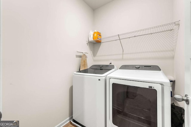 228 Whitneys Way, Dallas, GA 30157 - laundry room with washer and clothes dryer and baseboards
