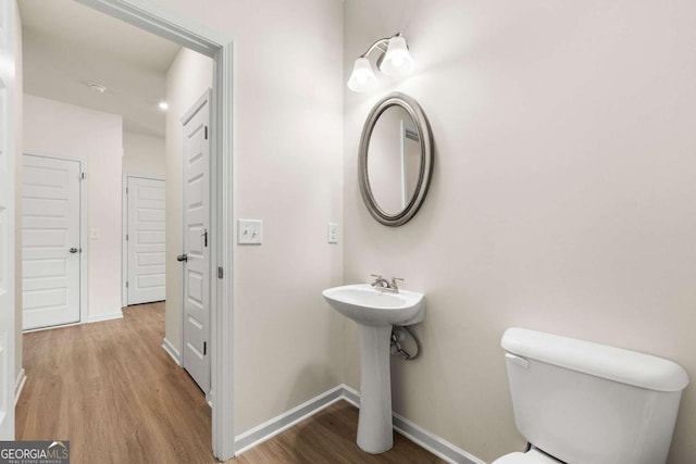 228 Whitneys Way, Dallas, GA 30157 - half bathroom with toilet and wood finished floors