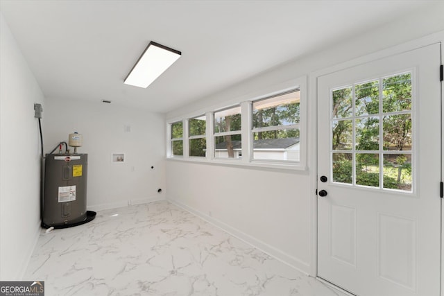 2310 Toussaint Ave, Savannah, GA 31404 - washroom with hookup for an electric dryer, water heater, washer hookup, and marble look tiles