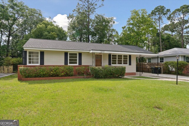 2310 Toussaint Ave, Savannah, GA 31404 - ranch-style house with an attached carport and driveway