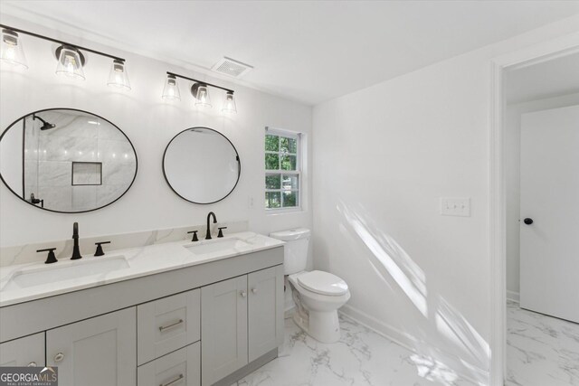 2310 Toussaint Ave, Savannah, GA 31404 - bathroom with marble finish floors, double vanity, and a shower
