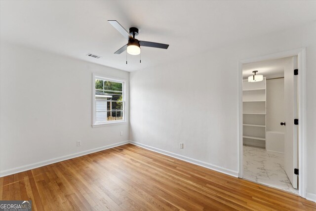 2310 Toussaint Ave, Savannah, GA 31404 - unfurnished room with ceiling fan and wood finished floors
