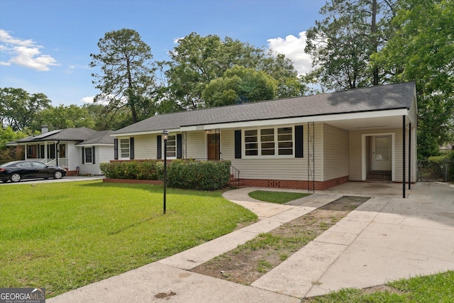 2310 Toussaint Ave, Savannah, GA 31404 - single story home with driveway, a front lawn, an attached carport, and roof with shingles