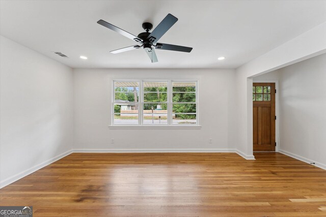 2310 Toussaint Ave, Savannah, GA 31404 - spare room featuring healthy amount of natural light, light wood-type flooring, ceiling fan, and recessed lighting