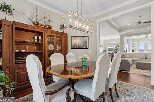 109 Carrington Ct, Kingsland, GA 31548 - dining space featuring wood-type flooring, ornamental molding, a ceiling fan, recessed lighting, and a chandelier