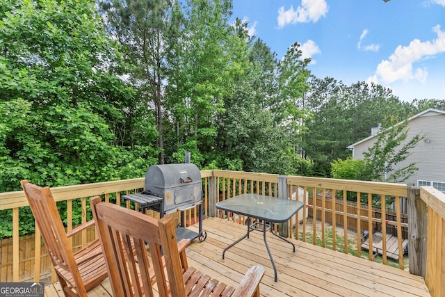 8436 Cyprus Ridge Way, Douglasville, GA 30134 - wooden terrace featuring a grill, view of wooded area, and outdoor dining area