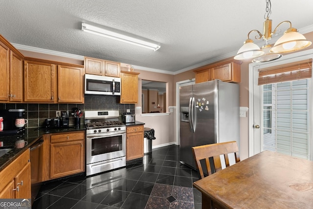 8436 Cyprus Ridge Way, Douglasville, GA 30134 - kitchen featuring stainless steel appliances, granite tiled floors, ornamental molding, dark countertops, and a chandelier