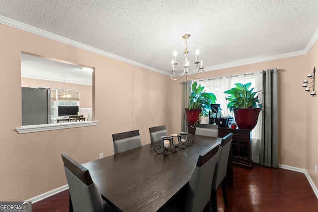 8436 Cyprus Ridge Way, Douglasville, GA 30134 - dining room featuring a chandelier, baseboards, a textured ceiling, crown molding, and dark wood-style flooring