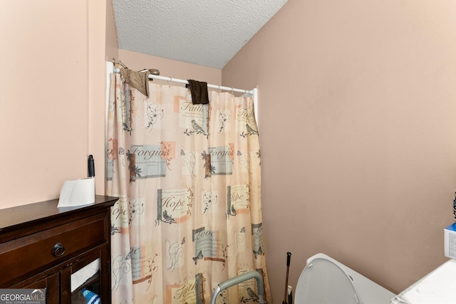 8436 Cyprus Ridge Way, Douglasville, GA 30134 - full bath with toilet, a textured ceiling, a shower with curtain, and vanity