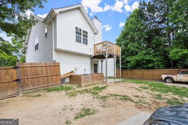 8436 Cyprus Ridge Way, Douglasville, GA 30134 - rear view of house with a wooden deck and a gate