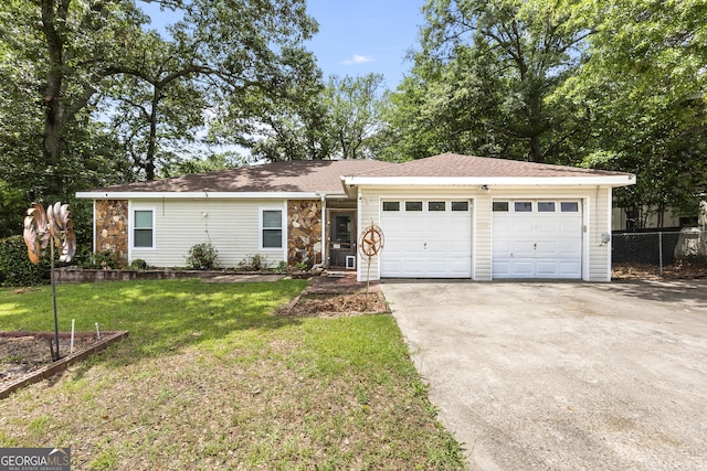 214 Highland Dr, Warner Robins, GA 31088 - single story home featuring driveway, an attached garage, and stone siding