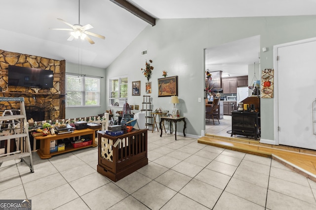 214 Highland Dr, Warner Robins, GA 31088 - living area featuring ceiling fan, light tile patterned floors, beamed ceiling, and high vaulted ceiling