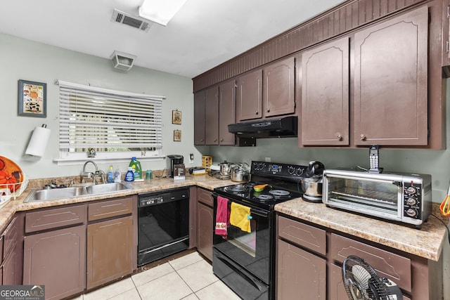 214 Highland Dr, Warner Robins, GA 31088 - kitchen with black appliances, a sink, under cabinet range hood, light tile patterned flooring, and light countertops