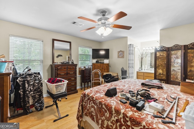 214 Highland Dr, Warner Robins, GA 31088 - bedroom with light wood-style flooring and a ceiling fan