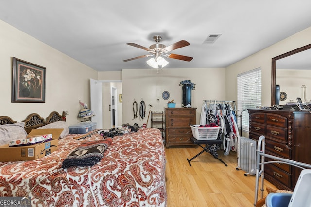214 Highland Dr, Warner Robins, GA 31088 - bedroom with wood finished floors and ceiling fan