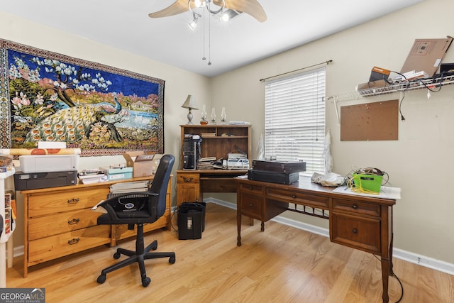 214 Highland Dr, Warner Robins, GA 31088 - home office with light wood finished floors, ceiling fan, and baseboards