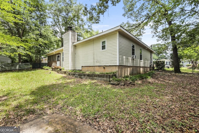 214 Highland Dr, Warner Robins, GA 31088 - view of side of property featuring a chimney