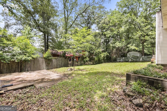 214 Highland Dr, Warner Robins, GA 31088 - view of yard featuring a shed and a patio area