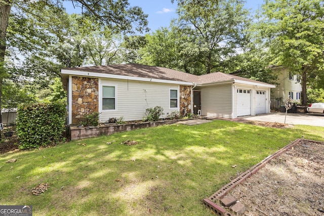 214 Highland Dr, Warner Robins, GA 31088 - view of front of house featuring an attached garage, stone siding, concrete driveway, a front lawn, and roof with shingles