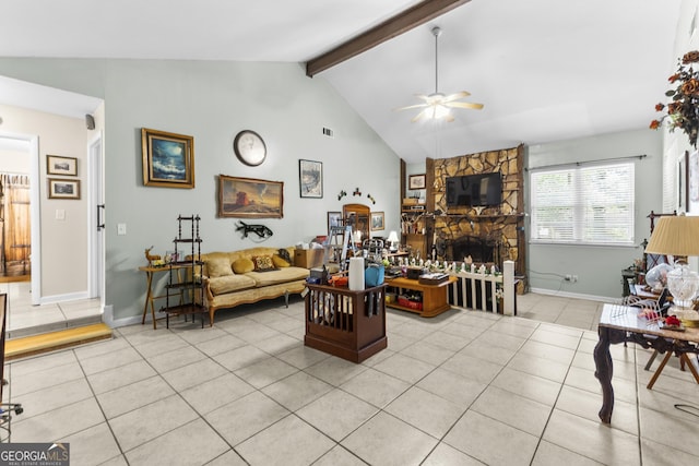 214 Highland Dr, Warner Robins, GA 31088 - living room featuring ceiling fan, light tile patterned flooring, a fireplace, and baseboards