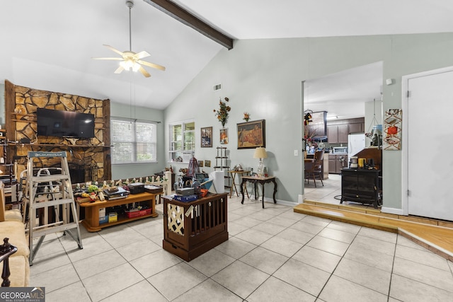 214 Highland Dr, Warner Robins, GA 31088 - living room with ceiling fan, light tile patterned floors, beamed ceiling, and high vaulted ceiling