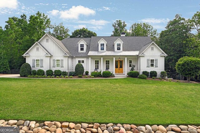 221 Goss Ln, Ball Ground, GA 30107 - modern inspired farmhouse with board and batten siding, covered porch, and a front yard