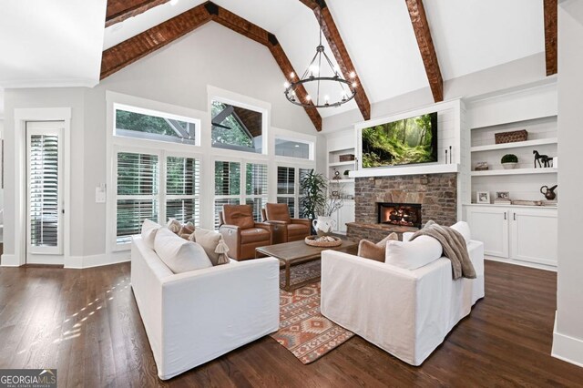 221 Goss Ln, Ball Ground, GA 30107 - living room featuring a chandelier, a warm lit fireplace, high vaulted ceiling, dark wood-type flooring, and beamed ceiling