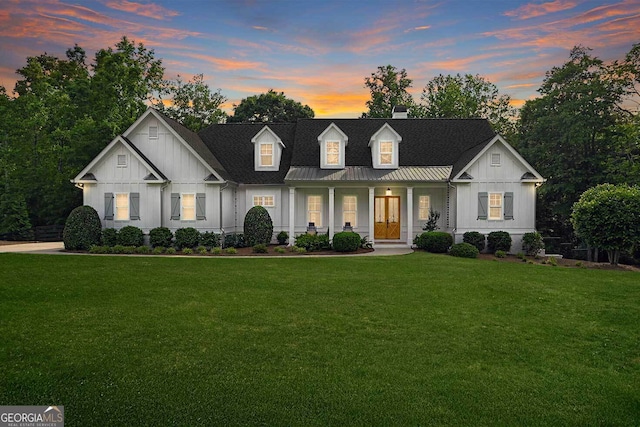 221 Goss Ln, Ball Ground, GA 30107 - modern farmhouse with board and batten siding, a porch, a front yard, and a chimney