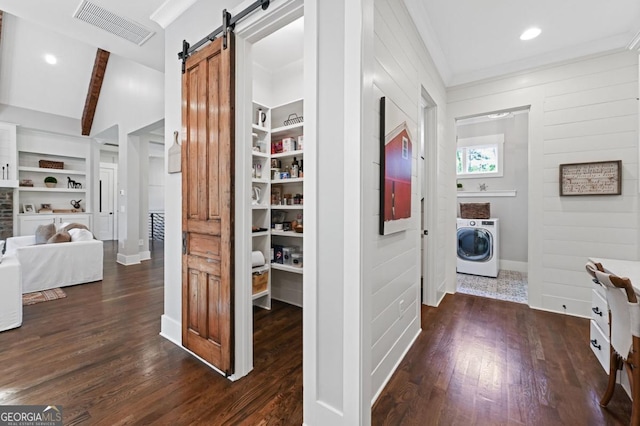 221 Goss Ln, Ball Ground, GA 30107 - hallway featuring washer / clothes dryer, a barn door, dark wood-style flooring, built in shelves, and crown molding