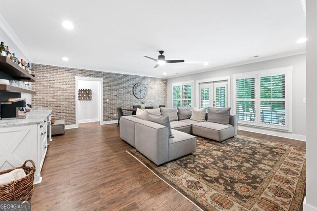 221 Goss Ln, Ball Ground, GA 30107 - living area with ceiling fan, brick wall, wood finished floors, ornamental molding, and recessed lighting