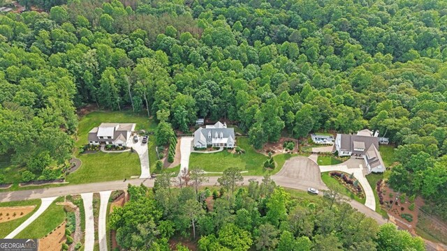 221 Goss Ln, Ball Ground, GA 30107 - aerial view of property and surrounding area with a heavily wooded area