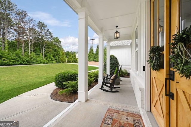 221 Goss Ln, Ball Ground, GA 30107 - covered porch with a lawn