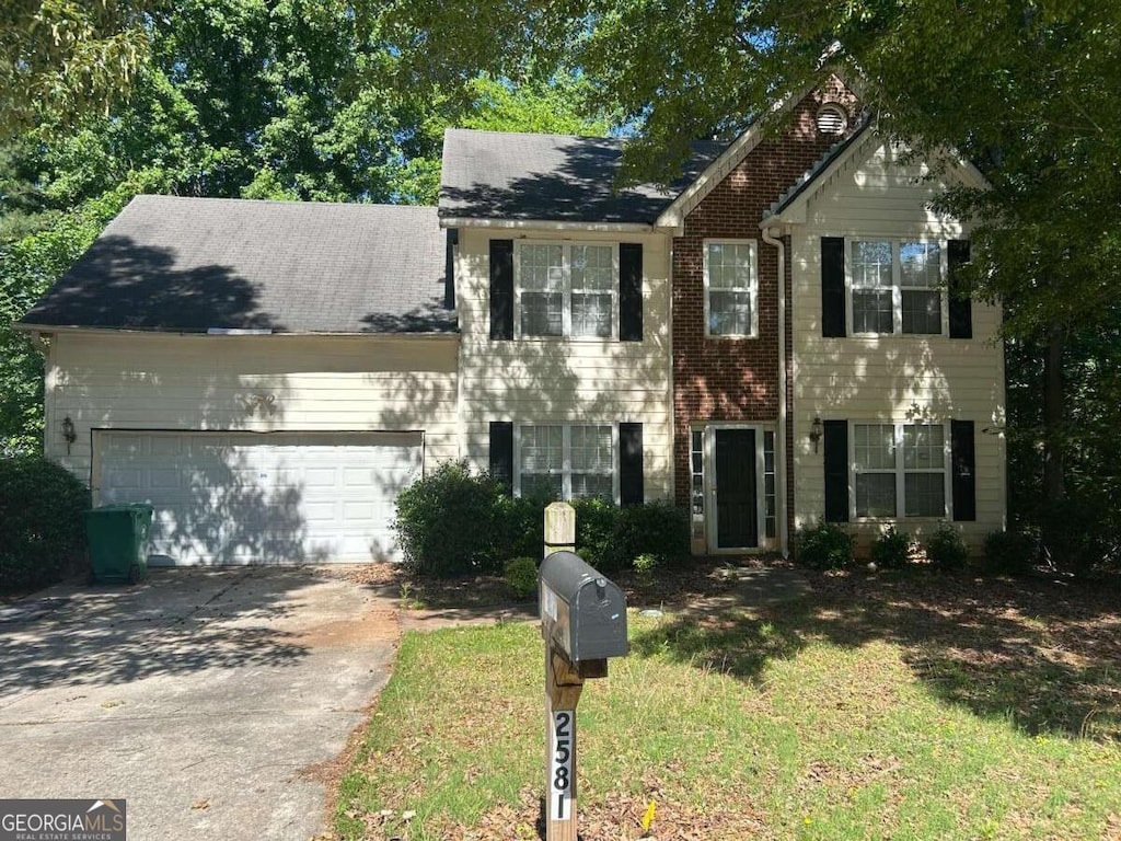 2581 Star Ln, Decatur, GA 30034 - view of front of house with a garage, driveway, and brick siding