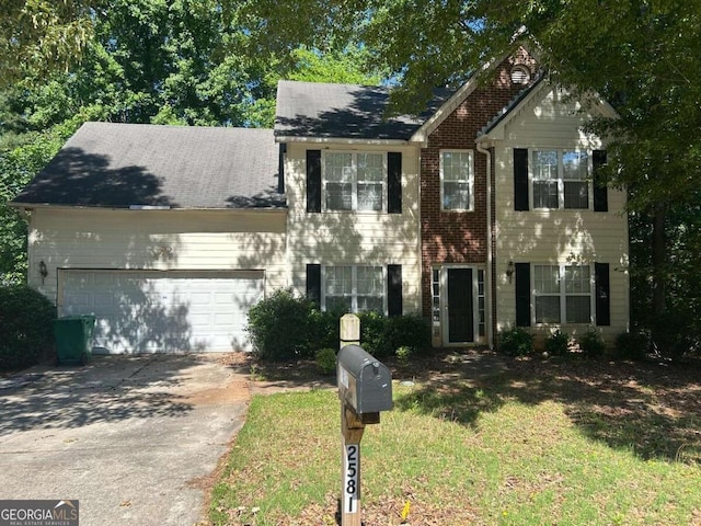 2581 Star Ln, Decatur, GA 30034 - view of front of house with a garage, driveway, and brick siding