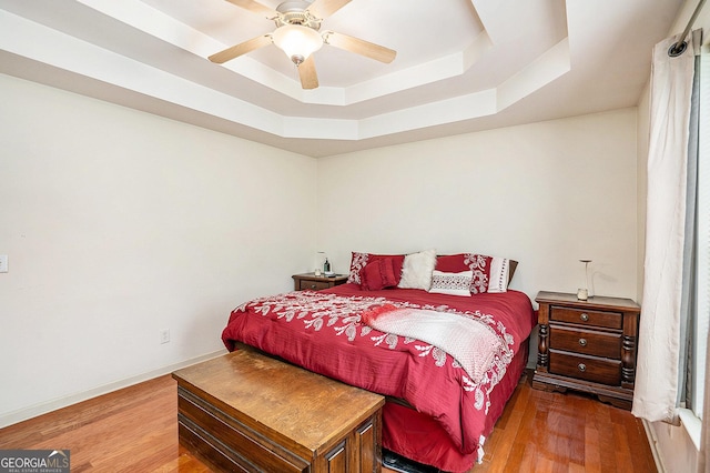 259 Hanover Cir SE, Calhoun, GA 30701 - bedroom with a raised ceiling, wood finished floors, and ceiling fan