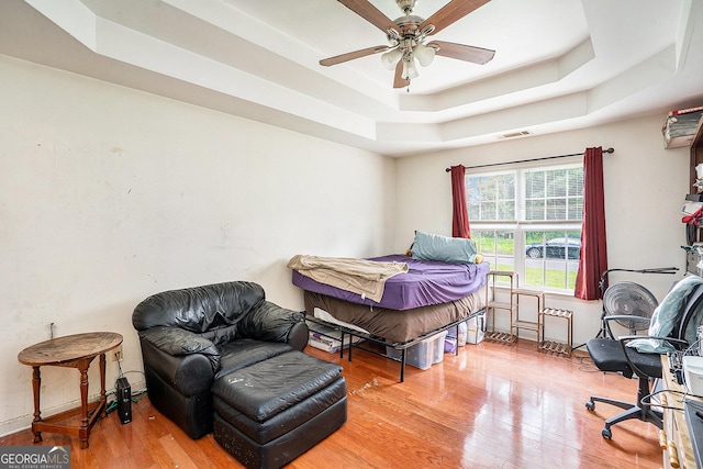259 Hanover Cir SE, Calhoun, GA 30701 - bedroom featuring a tray ceiling and wood finished floors