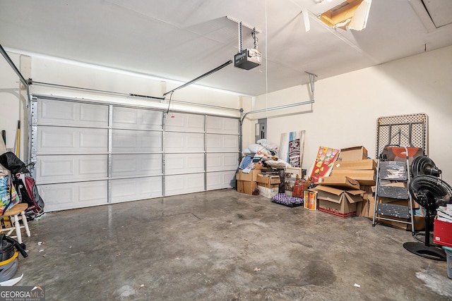 259 Hanover Cir SE, Calhoun, GA 30701 - garage featuring a garage door opener and electric panel