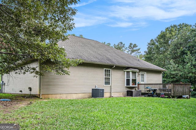 259 Hanover Cir SE, Calhoun, GA 30701 - rear view of house featuring a yard, a deck, and roof with shingles