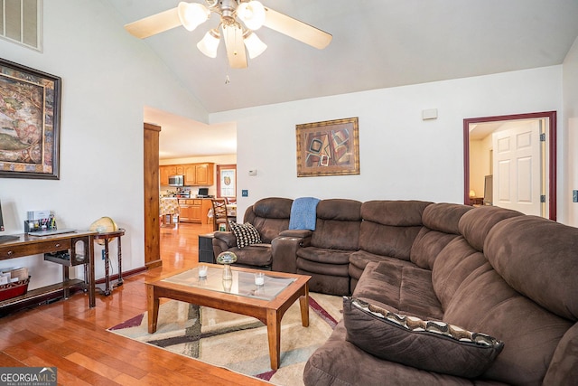 259 Hanover Cir SE, Calhoun, GA 30701 - living area featuring light wood finished floors, ceiling fan, and vaulted ceiling