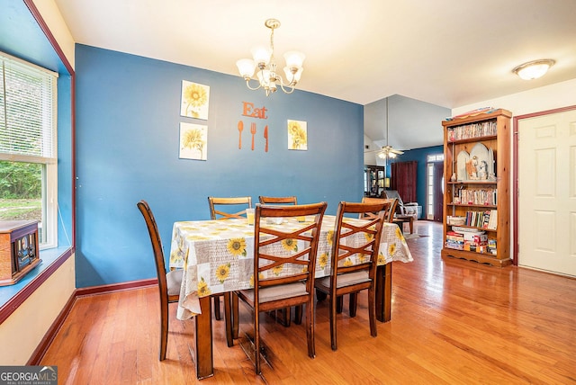 259 Hanover Cir SE, Calhoun, GA 30701 - dining room with light wood-type flooring, a chandelier, and ceiling fan