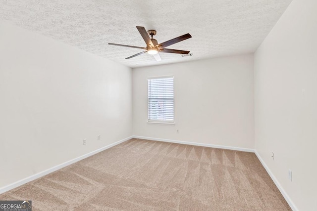 1186 Hawthorn Ln, Grayson, GA 30017 - spare room featuring a ceiling fan, light colored carpet, and a textured ceiling