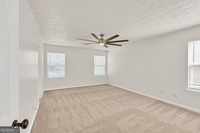1186 Hawthorn Ln, Grayson, GA 30017 - spare room with ceiling fan, light colored carpet, and a textured ceiling